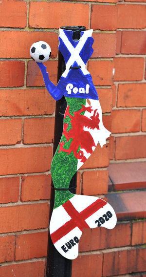 This mermaid is in the footballing spirit