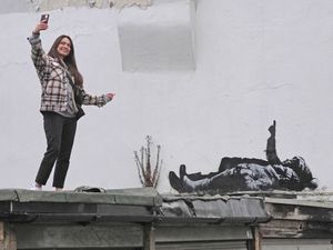 Supporting image for story: Banksy claims Bayswater artwork that shows two figures lying down