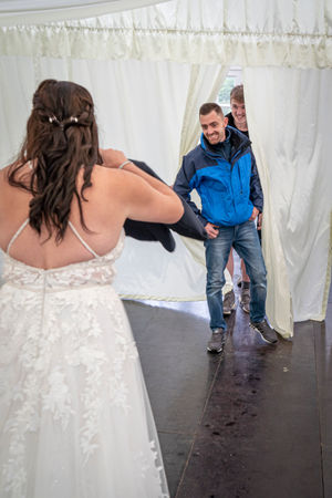 The moment Katrina asked Mark to marry her, holding up his suit. Picture: Spinning Your Dreams Wedding Photography