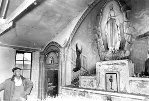 A fresco painted by an Italian prisoner of war in a makeshift church at a prisoner of war camp at Lynbrooke Farm, Sheriffhales, seen here in 1972. When this hut was demolished the fresco was saved and taken to the attic of Salters Hall in Newport