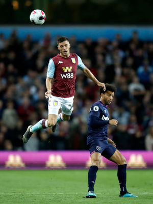 Aston Villa's Frederic Guilbert (left)