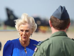 Supporting image for story: Windy welcome for Camilla as she visits allotment on air base