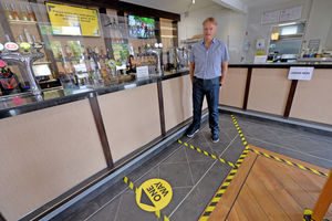 Owner Malcolm Guest with the one way system in operation and screens on the bar  