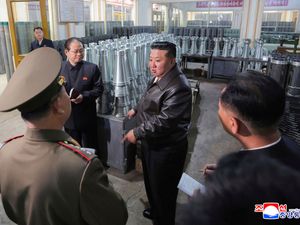 In this undated photo provided on Wednesday by the North Korean government, Kim Jong Un, centre, visits a munitions and machinery factory