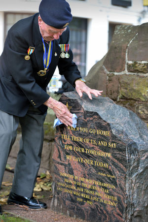 Wolverhampton Central Royal British legion victory in Japan service. Pictured, Legion chair Fred Bunce cleans the Burma memorial