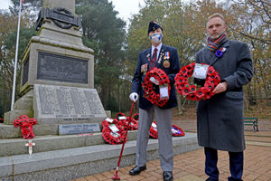 Derrick Ellison and Councillor Paul Woodhead pay tribute at the Hednesford War Memorial.