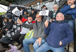 Players were wrapped up warm as they prepared for the big win. Credit: Jim Wall.