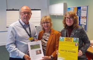 Campaigners hand over their petition to Sir David Nicholson - chairman of the board of directors at the Dudley Group NHS Foundation Trust