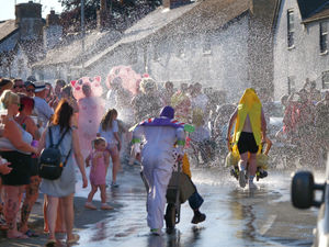 On such a scorching night, the racers were grateful for a little cooling down on their way around. Image Laura Shepherds Lens Photography