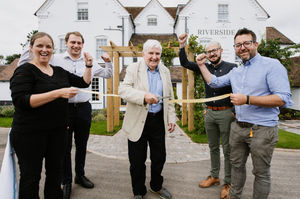 David Rawlings, centre, officially opens the Riverside Inn, along with, from left; Jo Perry, Scott Meade, David McGrath and Chris Kendall