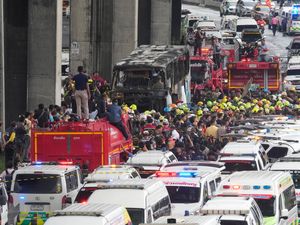 Supporting image for story: Thai police arrest driver of school bus fire that killed 23