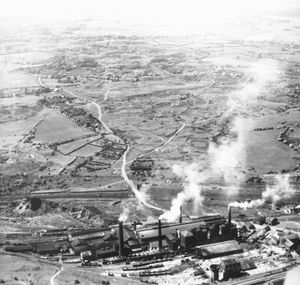 A view from perhaps the 1950s showing Priorslee Furnaces of the Lilleshall Company, foreground, and looking towards the site of what is today Telford town centre beyond. 