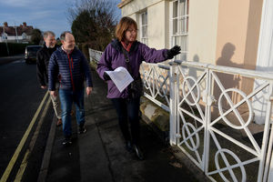 Linda Timmis counts the circles on the fence as part of the walking treasure hunt