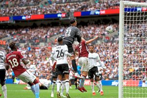 Aston Villa's John McGinn (right) scores his side's second goal of the game during the Sky Bet Championship Play-off final at Wembley Stadium