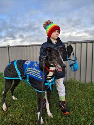 He's out walking the dogs with mom, Jen, come rain, shine or snow!