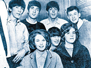 The Beatles with some young fans in November, 1963