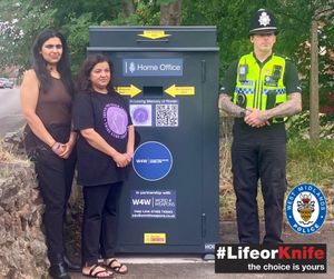 Pooja Kanda, Nikita Kanda with PC Matt Beards at the site of the new surrender bin unveiled in Wolverhampton.