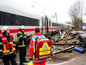 Emergency services at the scene of the accident at a level crossing in Hamburg, Germany