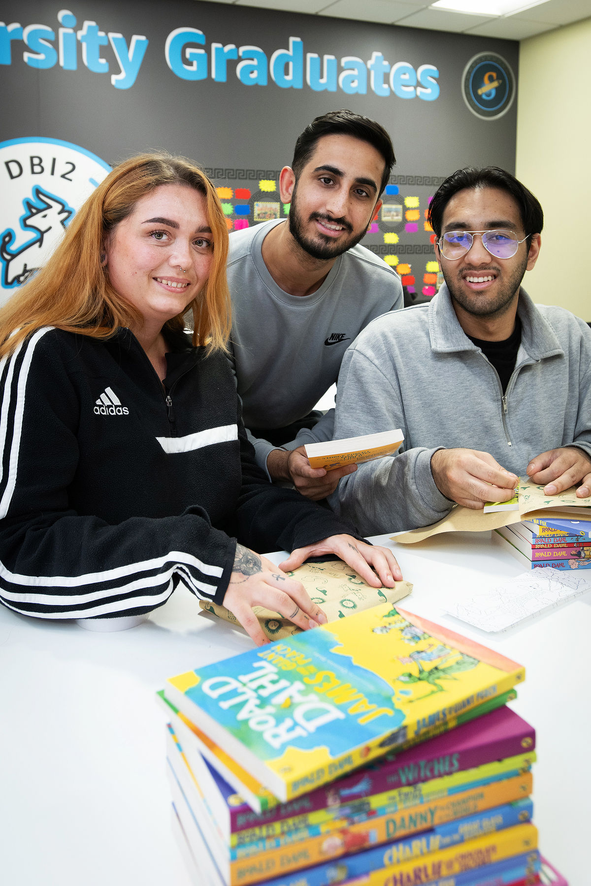 Amazon team packs books to donate to families and children in need
