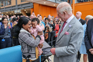 During his visit, King Charles III talked with Semher Tesfu who is holding her baby Hernata Yonas