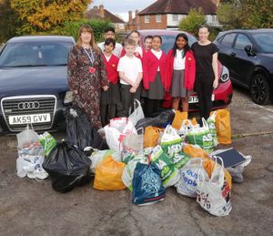 Pupils at Hasluck Green Primary School with some of the bags of shoes.