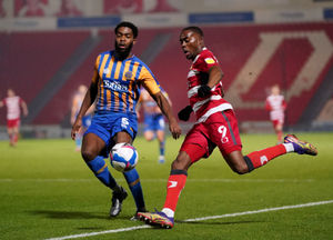 Doncaster Rovers' Fejiri Okenabirhie (right) and Shrewsbury Town's Ro-Shaun Williams