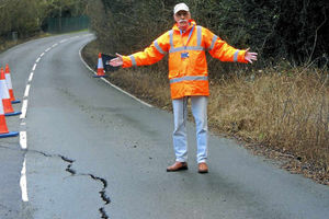 Cllr DaveTremellen surveys the damage on New Road, Highley