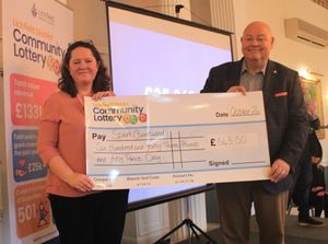 Esther Allen, CEO of Spark receives a cheque from Councillor Richard Cox on behalf of Lichfield District Community Lottery.