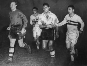 Bert Williams (left), Eddie Stuart (centre) and the legendary Ferenc Puskas (right) leave the field after Wolves beat Honved 3-2