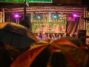 Supporting image for story: 18 festive photos from a soggy Shrewsbury's Carols in the Square