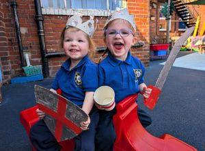 Sisters, 2-year-old Nelly and 4-year-old Scarlett Ward with their St. George’s crowns, swords, shields and decorated cups!