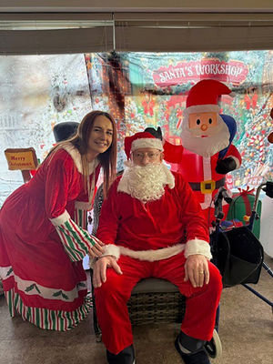 Santa with helper at HC-One’s Foley Grange Care Home’s Christmas Fair