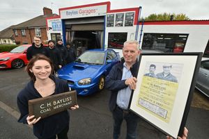 Bayliss Garages in Smethwick, which is celebrating its 65th anniversary. Managing director Peter Bayliss, aged 57, and his daughter (service advisor) Charlotte Bayliss, aged 26. At the back are staff: Brad Ferrier, Steve Michaels, Matthew Hebberts, Norman Palmer