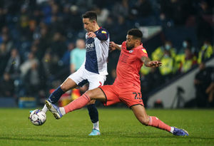 West Bromwich Albion's Callum Robinson and Swansea City's Cyrus Christie 
