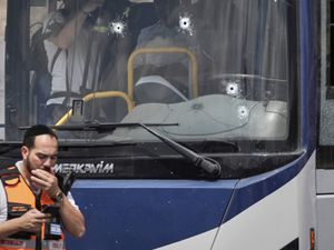 Supporting image for story: Palestinian gunmen open fire at Jerusalem bus stop, killing six