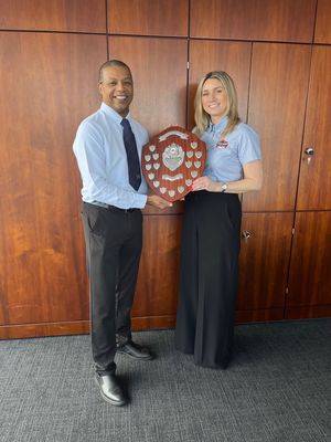 Jade Mason accepting her award from Andrell Dinham, Sales Director