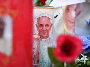 Candles and flowers for Pope Francis