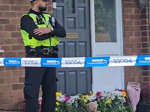 Supporting image for story: Murder probe: Floral tributes grow outside house where youth was stabbed 