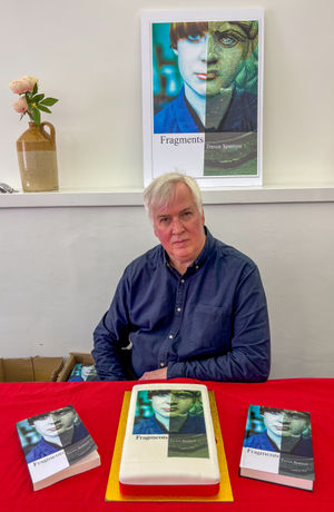 Trevor with book, in paperback, hardback and cake form.