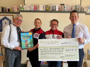 Supporting image for story: Football team and funeral home raise nearly £7,000 for charity