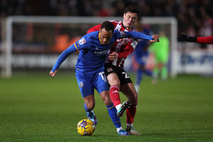 Elliott Bennett of Shrewsbury Town and Jack Aitchison of Exeter City (AMA)