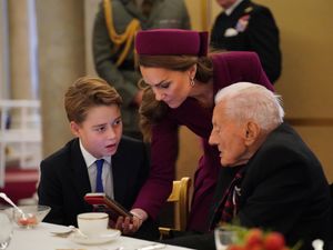 Prince George and the Princess of Wales join Second World War veterans at a tea party in Buckingham Palace