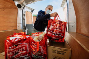 Driver Andy Gooding is filling the van up with customers shopping ready to deliver to them during lockdown in November 2020
