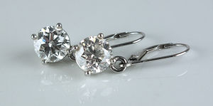 This pair of brilliant cut diamond earrings sold for £10,000.