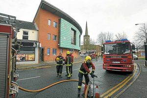 Firefighters outside the cafe after the fierce blaze in Wolverhampton