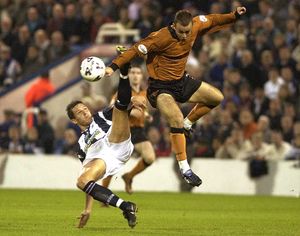Branch battles with Phil Gilchrist in a 2001 Black Country Dery meeting against West Brom