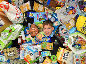 Pupils Zanis Motilkous, aged 14 and Jalieal Lilley, aged 13, from Westcroft School, Essington, with some of the food collected for the Feed A Family campaign
