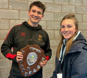Shifnal skipper Shaun Lorimer receives the trophy from Cricket Shropshire's Shannon Aston
