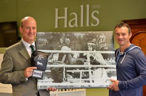 Jeremy Lamond of Halls auctioneers and Richie Woodhall with the signed photograph and boxing glove which goes under the hammer next week