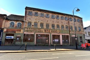 There are plenty of empty buildings and closed stores on streets along the high street